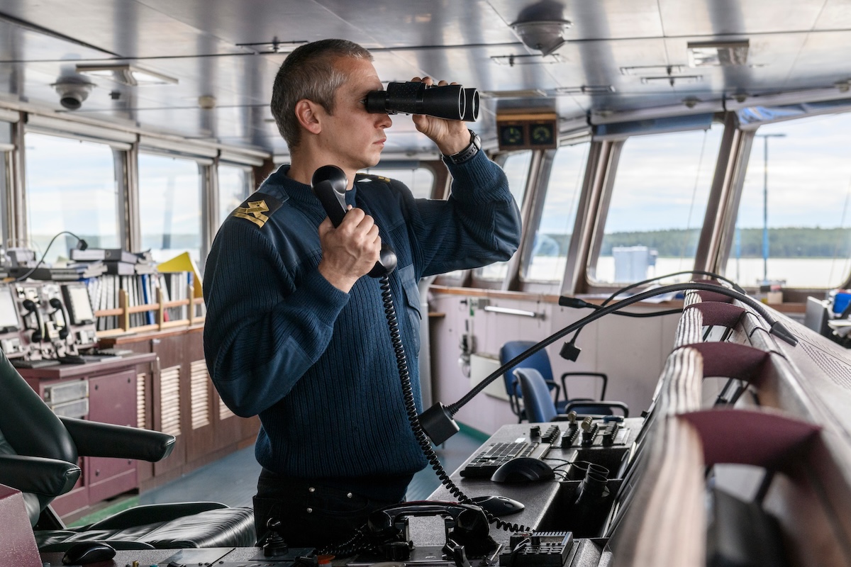 Ship crew member on the bridge of a ship